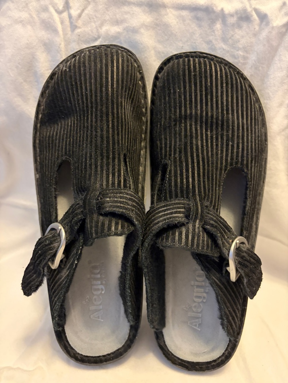 Alegria black clogs with shearling lining.